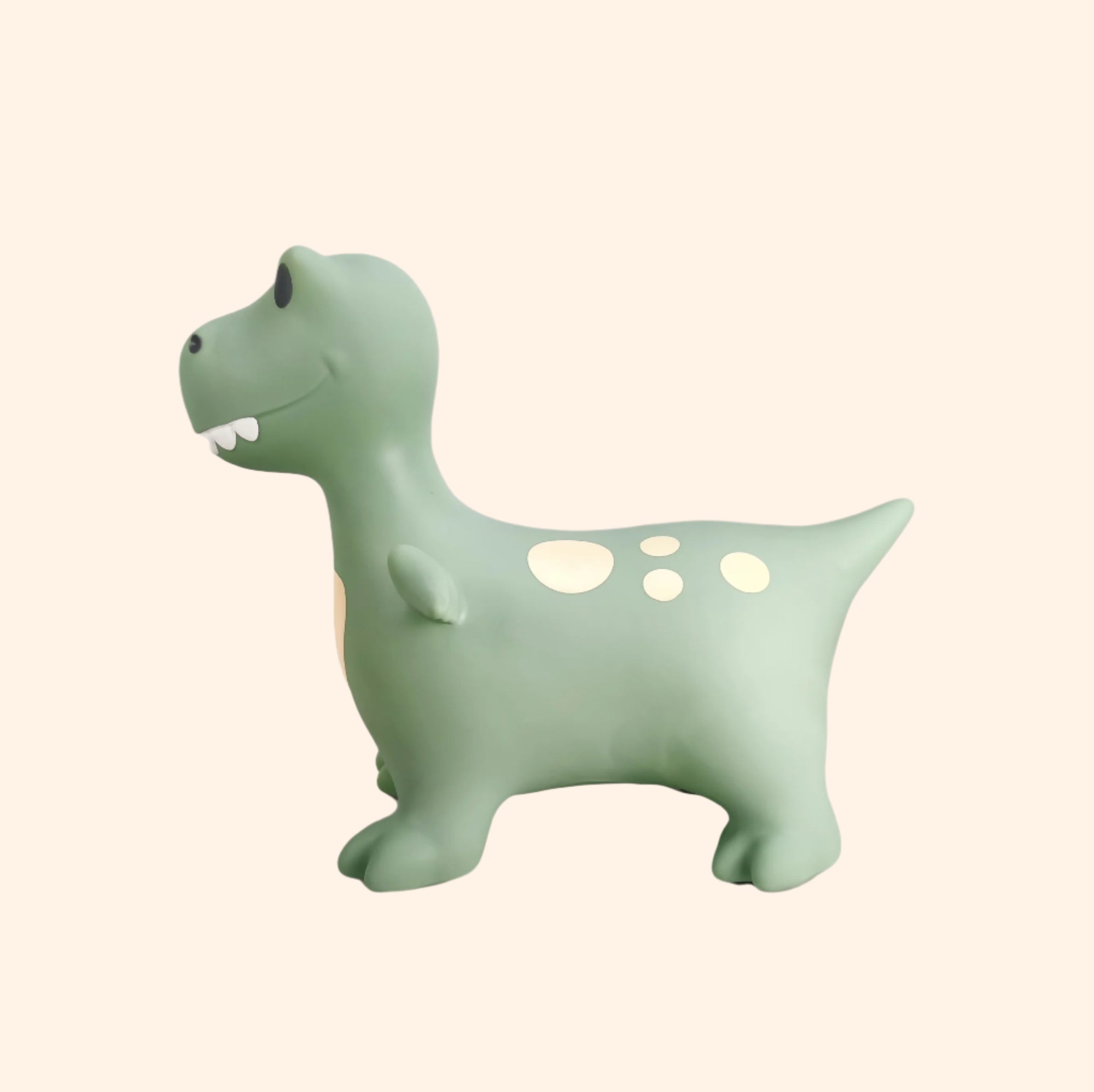 Side profile of Dexter sage green dinosaur bouncing toy with visible tail and details – Find That Hippo