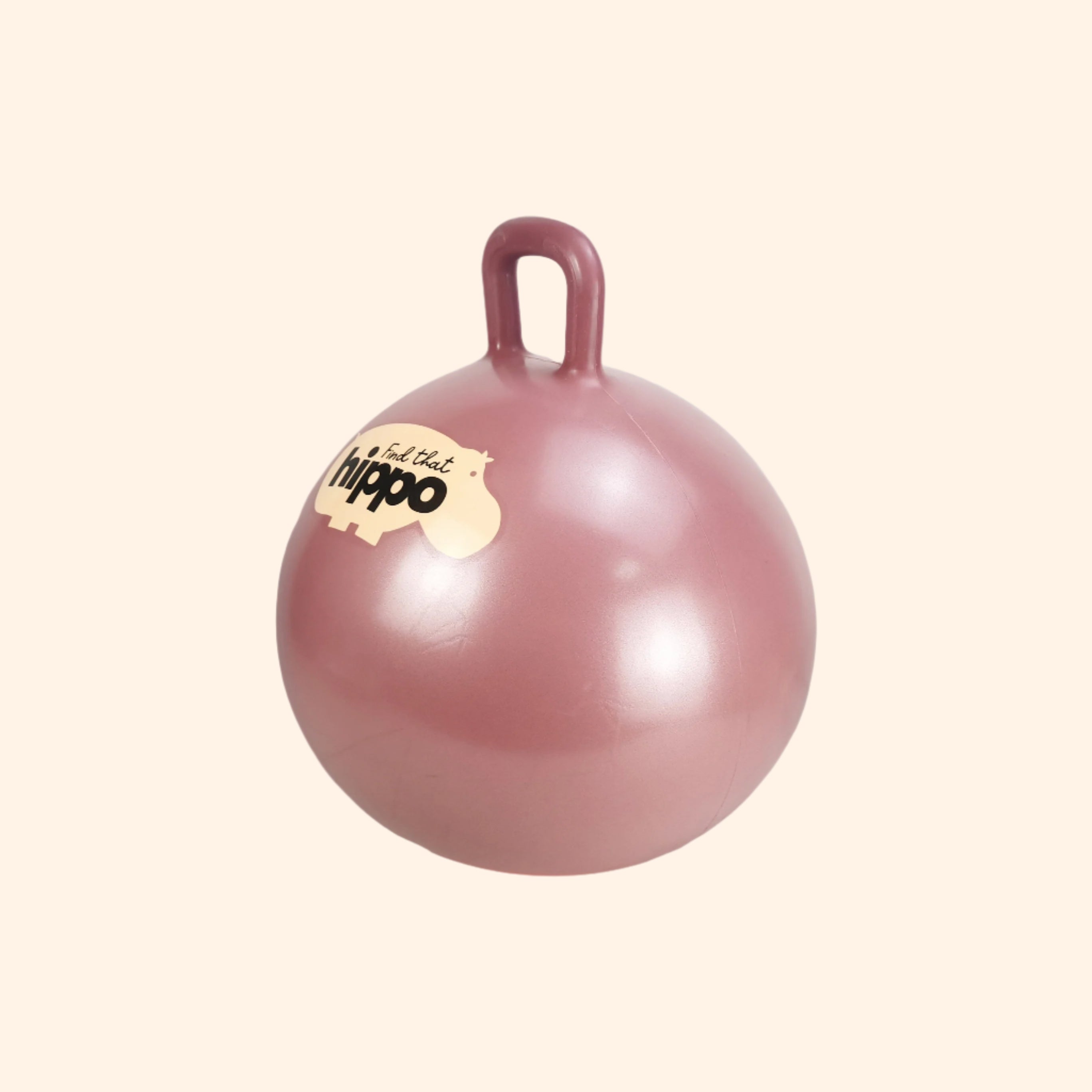 Side angle of dusty pink Hippo jumping ball showing logo and handle – Find That Hippo