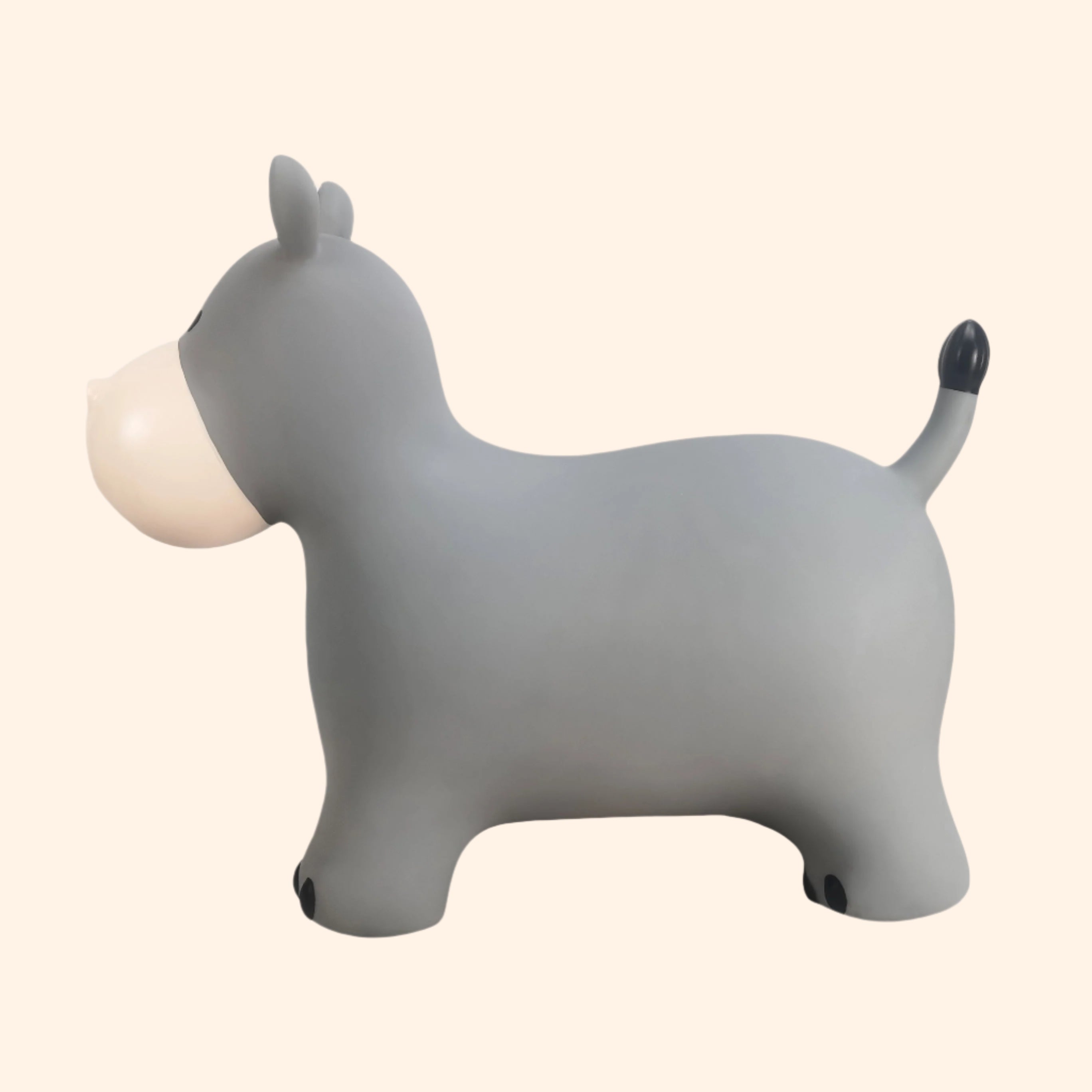 Side angle of Holger the hippo bouncing toy showing black tail and ears – Find That Hippo