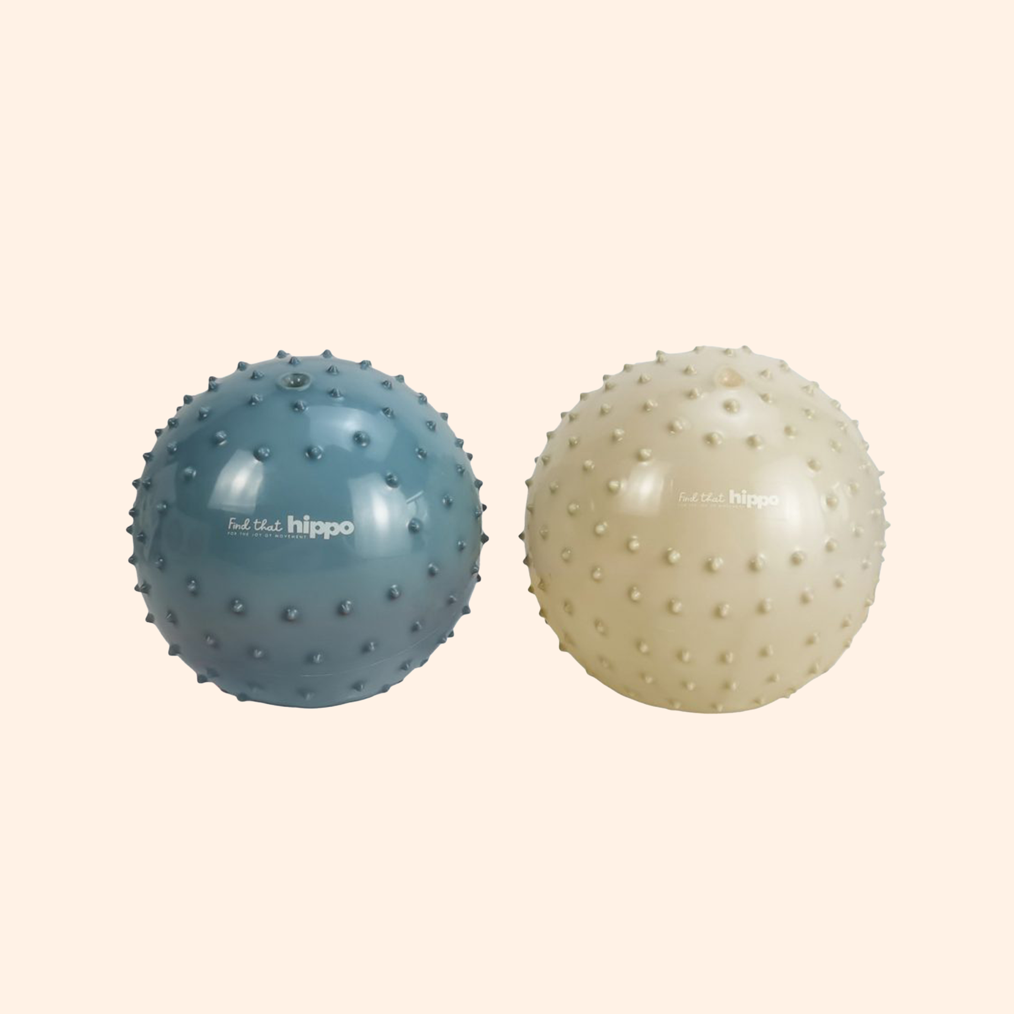 Bliue and green sensory balls placed side by side on a white background – Find That Hippo