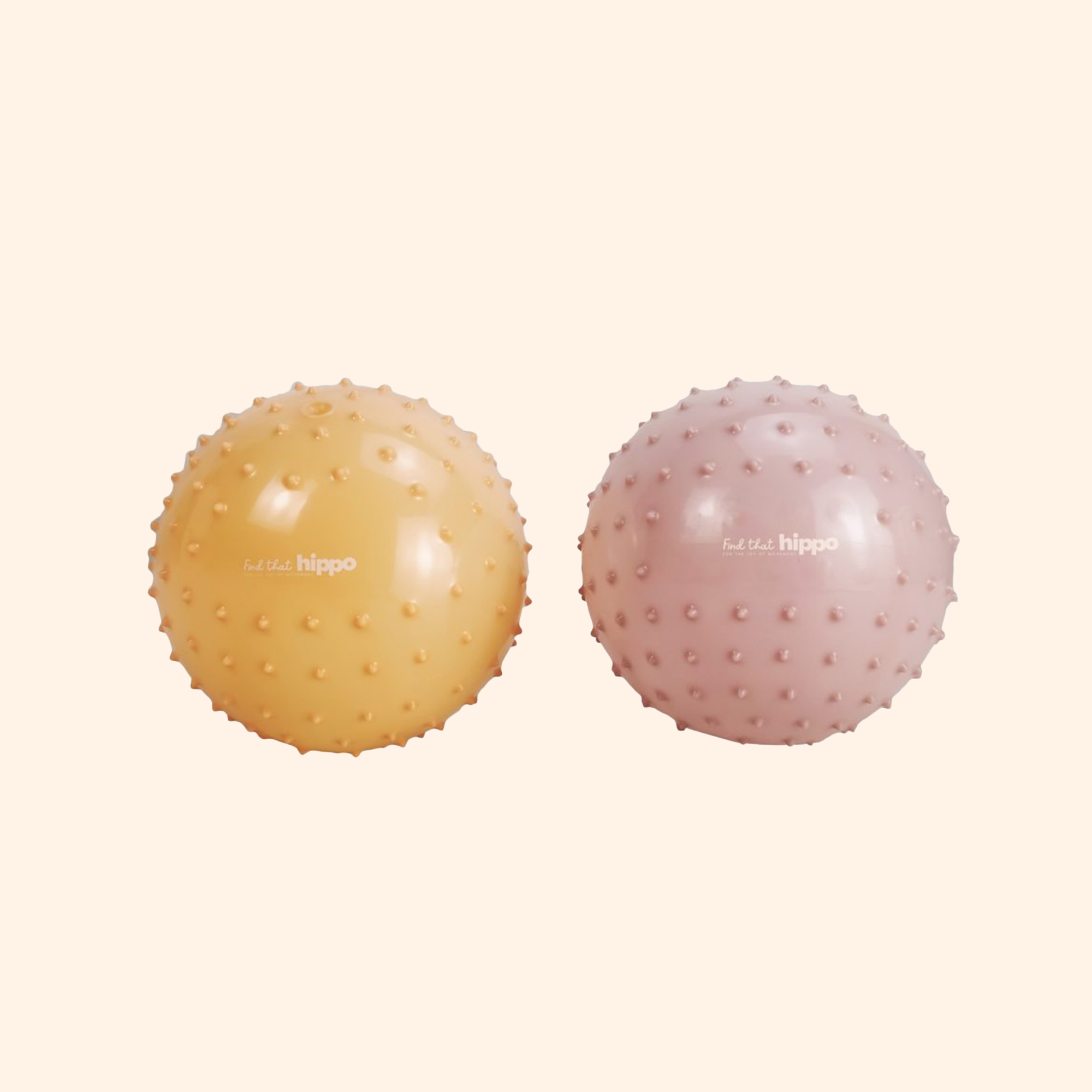 Pink and orange sensory balls displayed side by side  – Find That Hippo