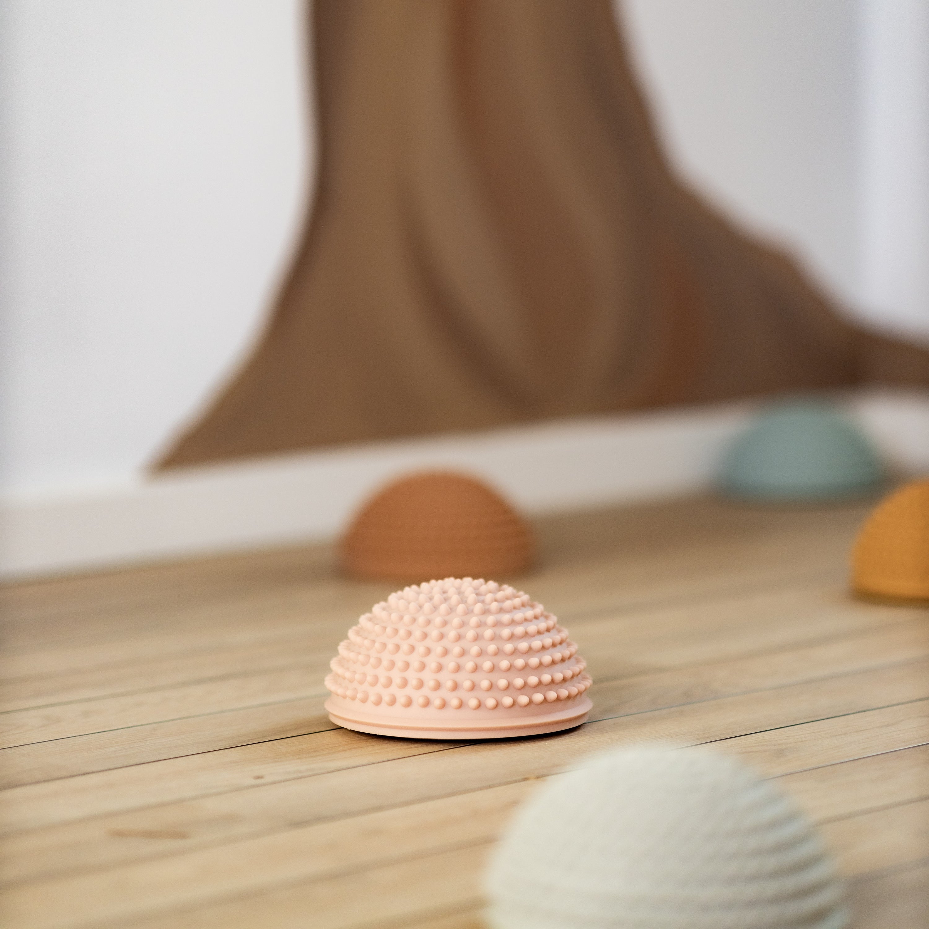 Close-up of sunrise-colored sensory stones – Find That Hippo