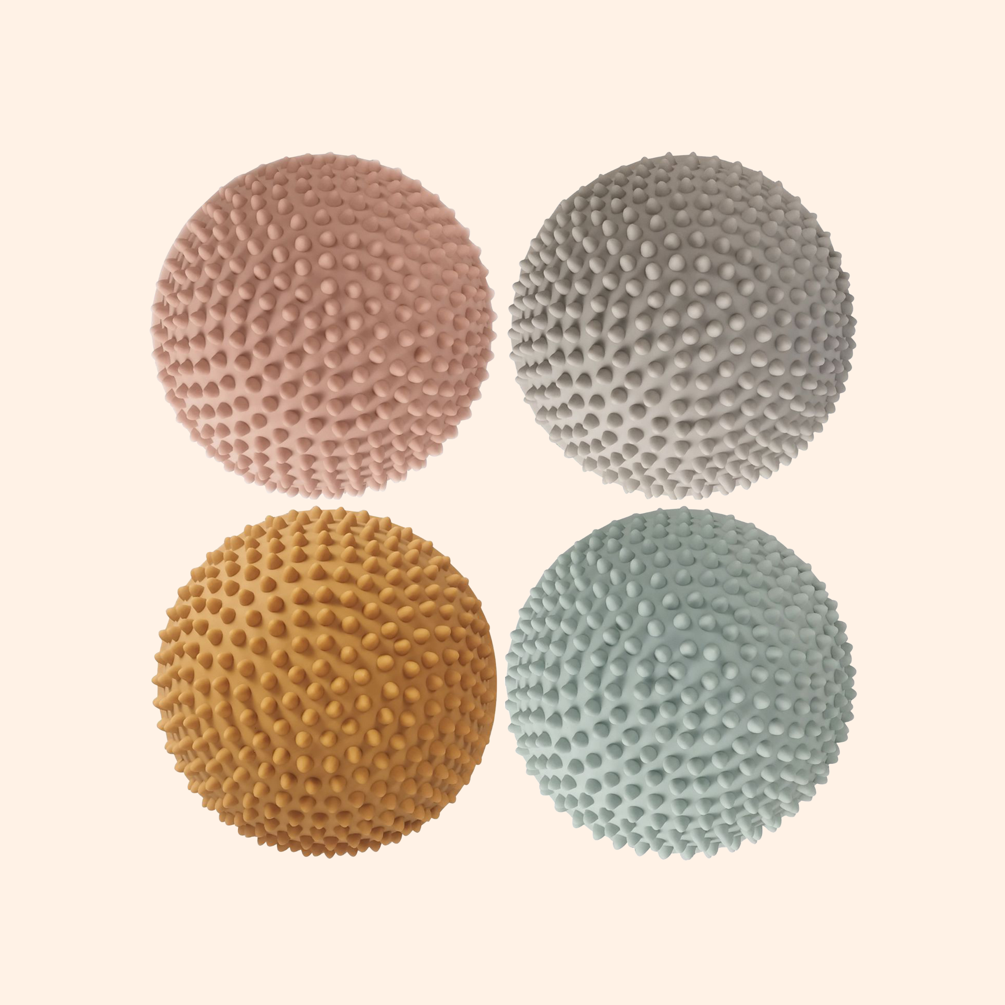 Top view of four Solopgang sensory stones showing color variation: ochre, sky blue, silver, and dusty pink – Find That Hippo